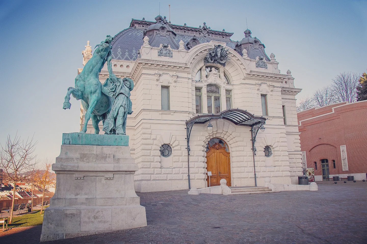Equestrian statue of a horse trainer in front of the Royal Riding Hall in Budapest’s Castle District.
