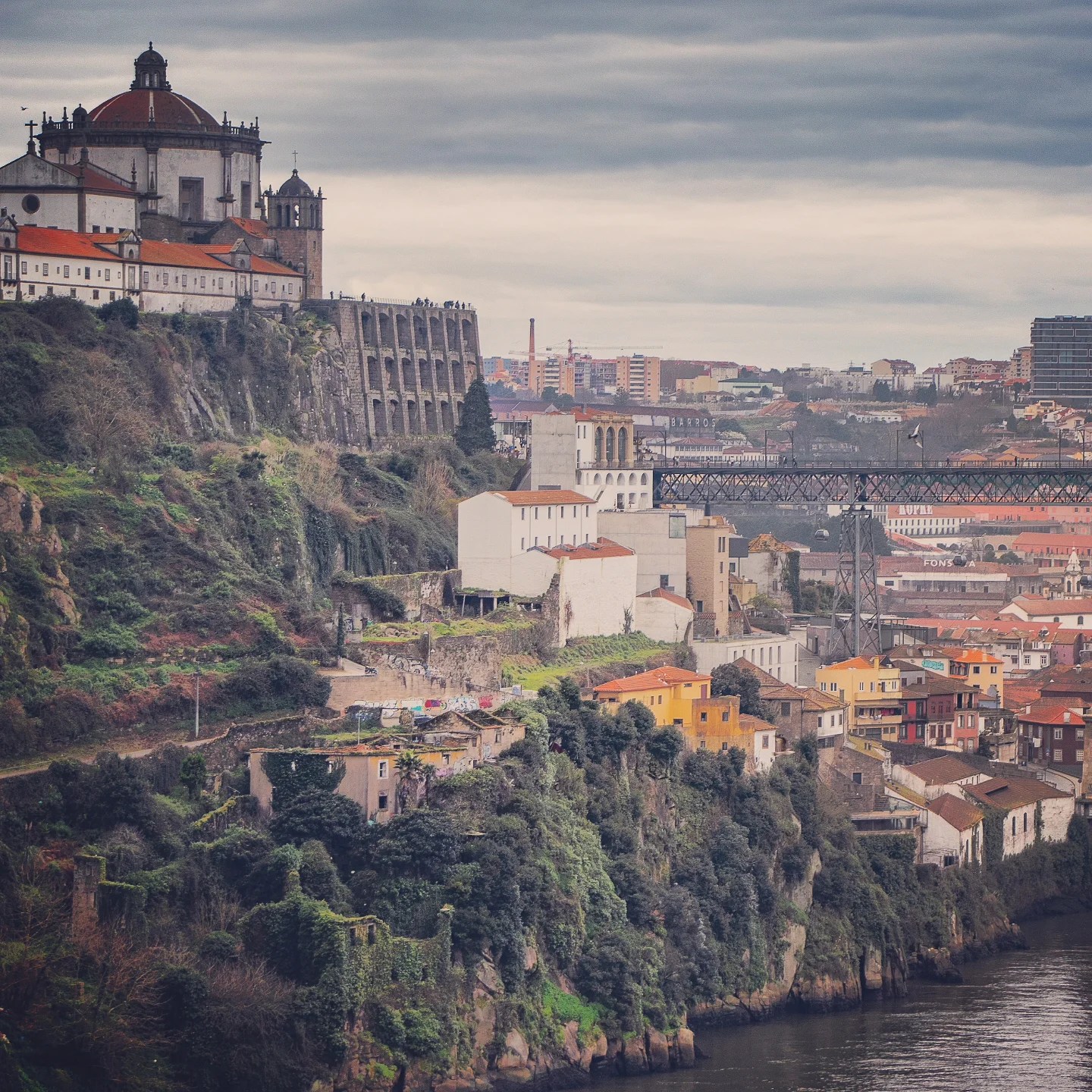 The Serra do Pilar Monastery with its round church and terraced stone buttresses overlooking the Douro River in Porto.