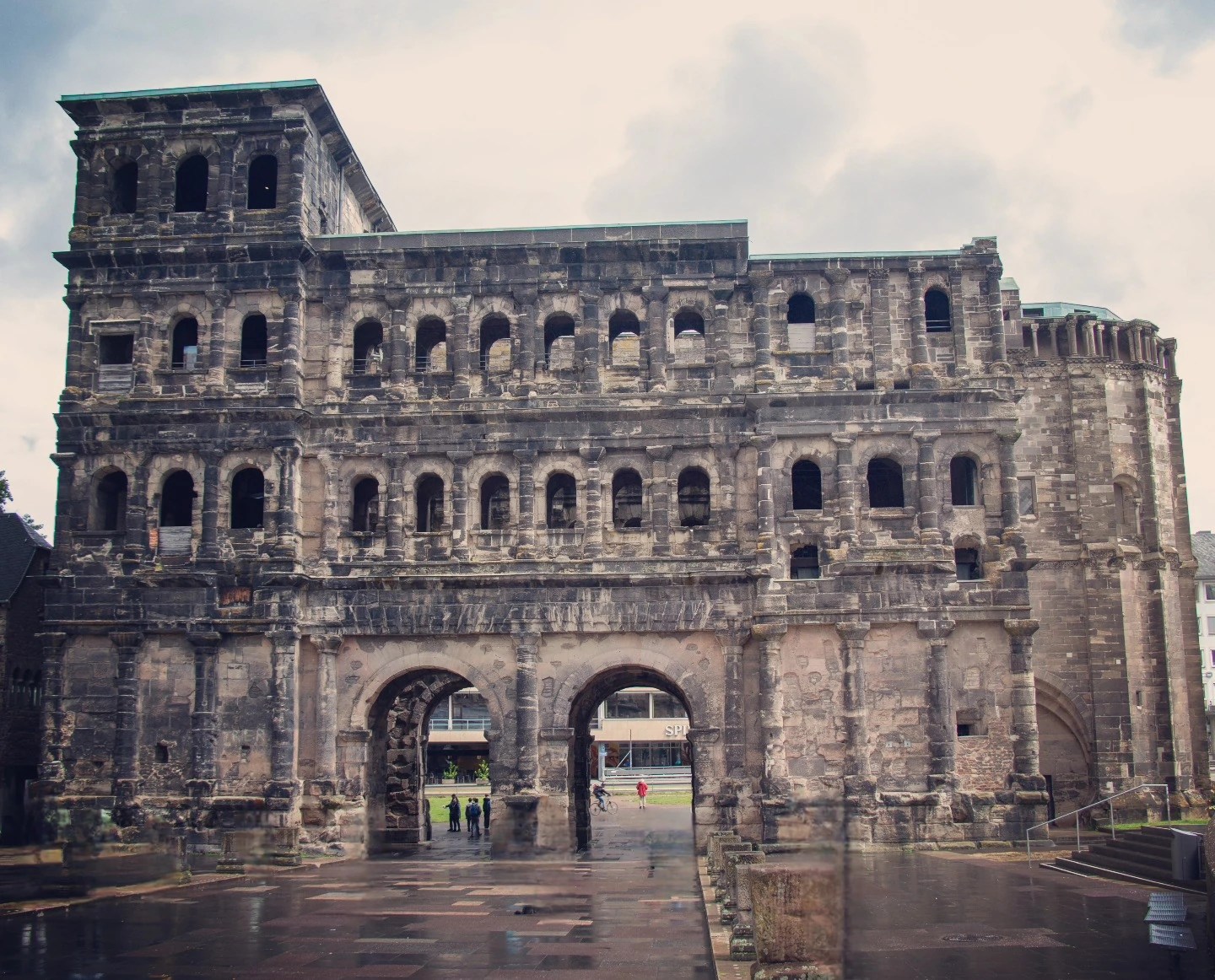 Roman Porta Nigra gate with two arched entrances in Trier, Germany.