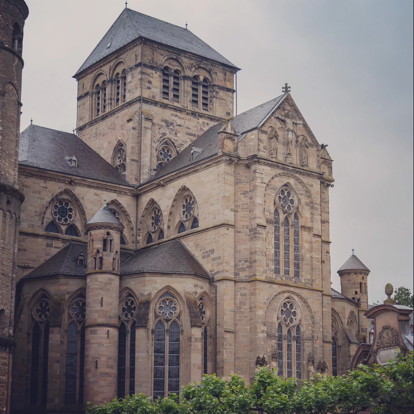 Exterior view of Trier Cathedral with Romanesque and Gothic architecture.