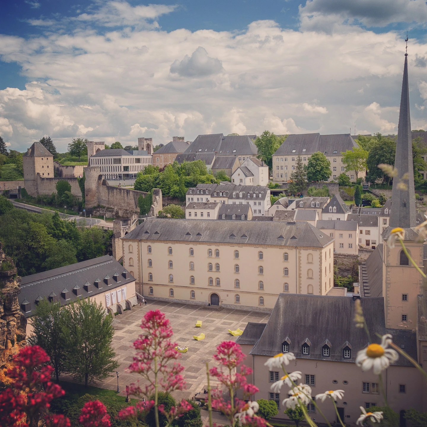 Aerial view of Neumünster Abbey courtyard with surrounding historic buildings in Luxembourg.