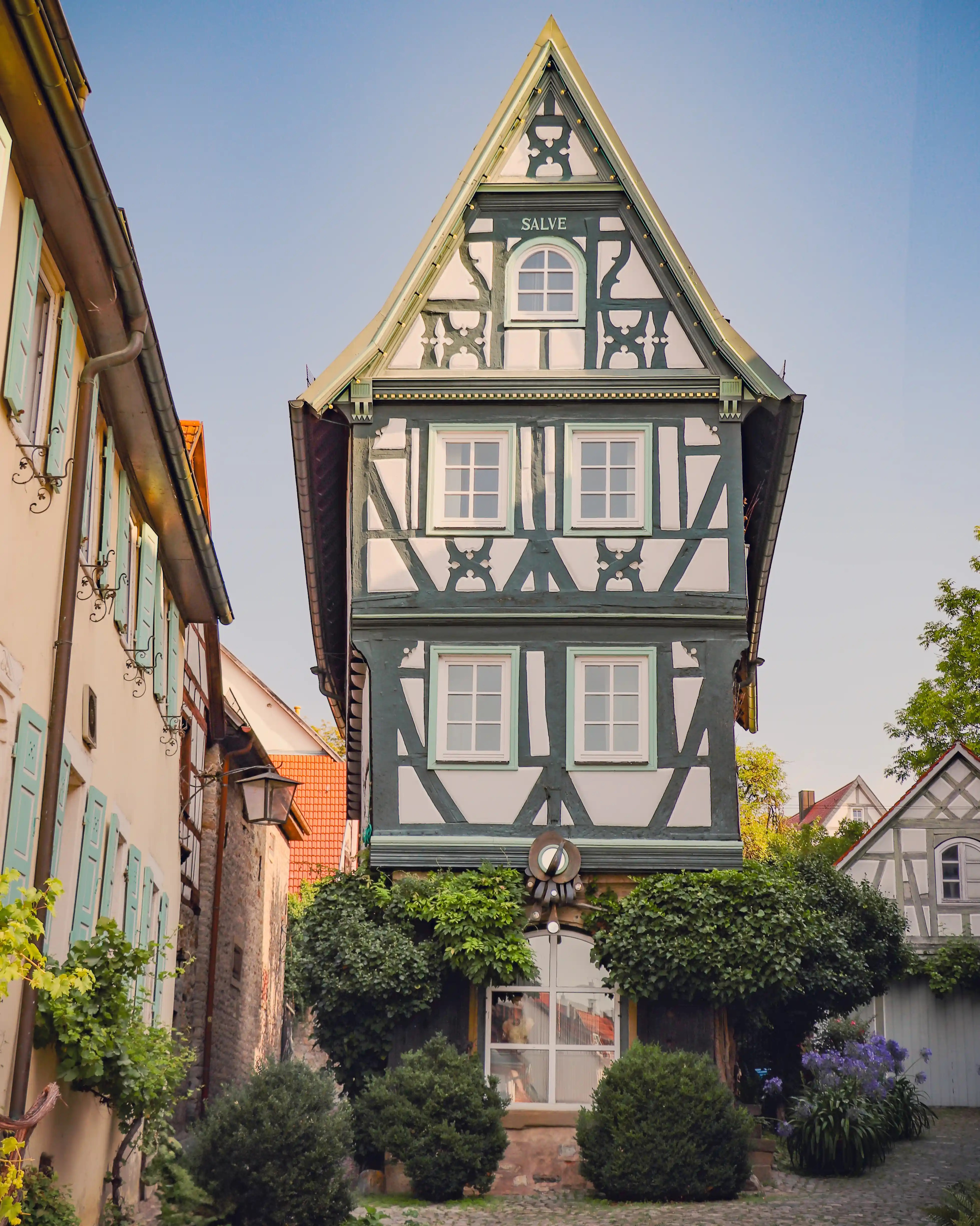Narrow gabled half-timbered house with “SALVE” on the facade, Bad Wimpfen old town.