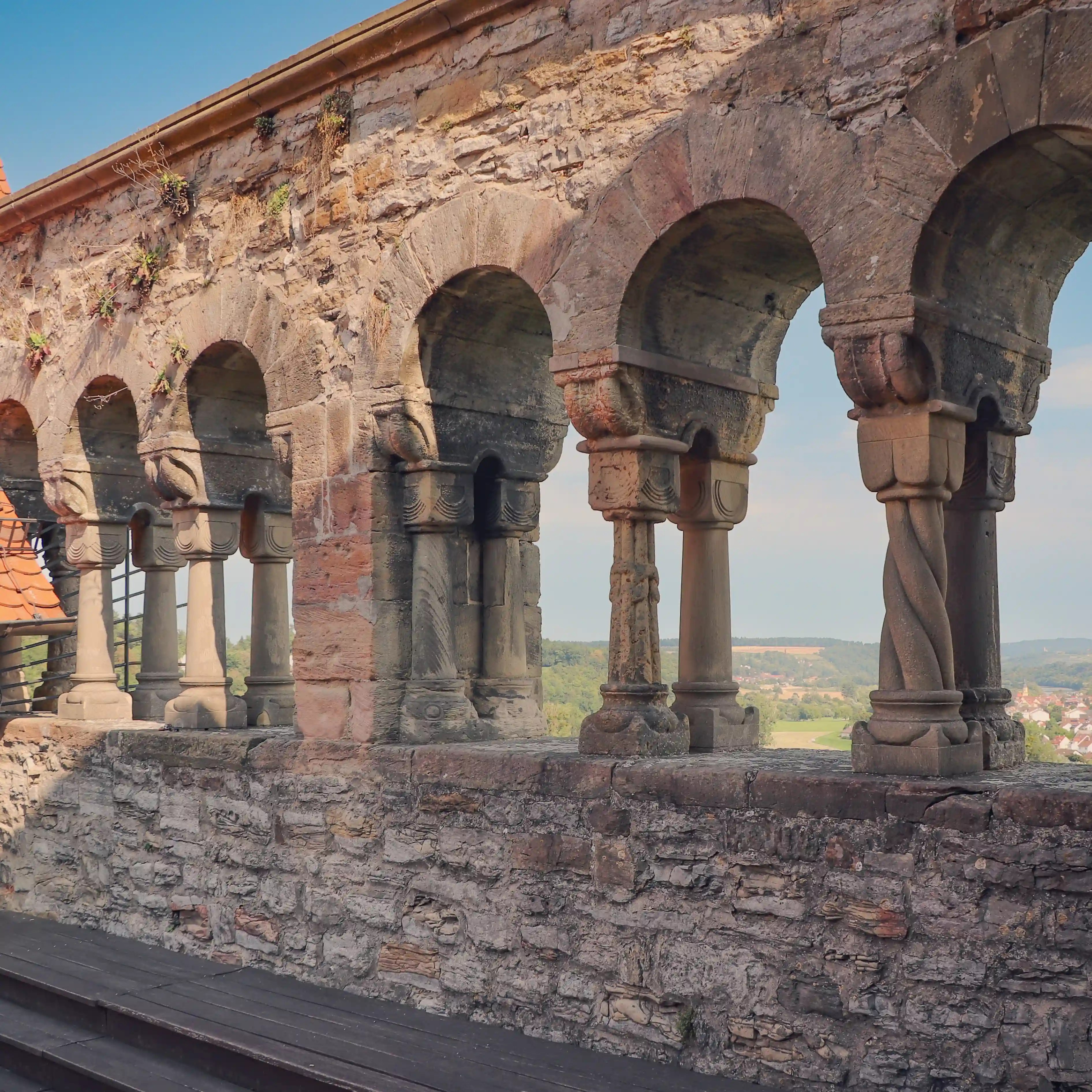 Romanesque arcaded gallery with carved capitals on the former imperial palace terrace, Bad Wimpfen.