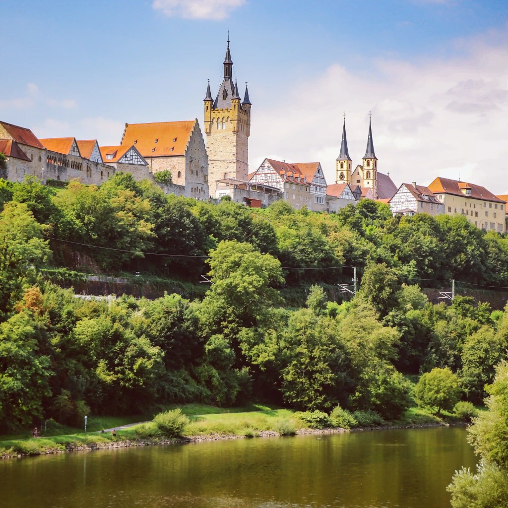 Hilltop old town of Bad Wimpfen with church spires seen across the Neckar River.