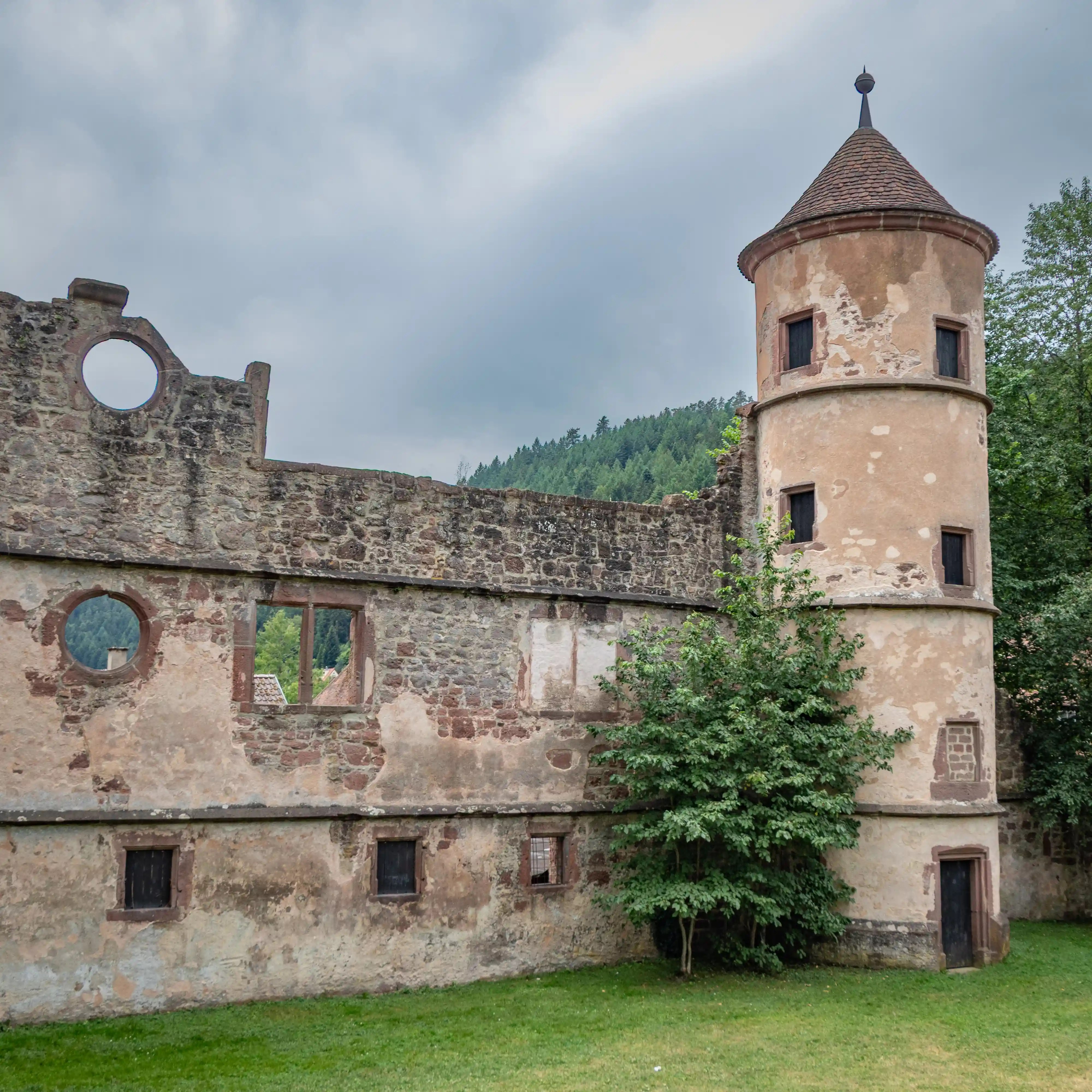 Ruined Hunting Lodge wall with a round tower at Hirsau Monastery.