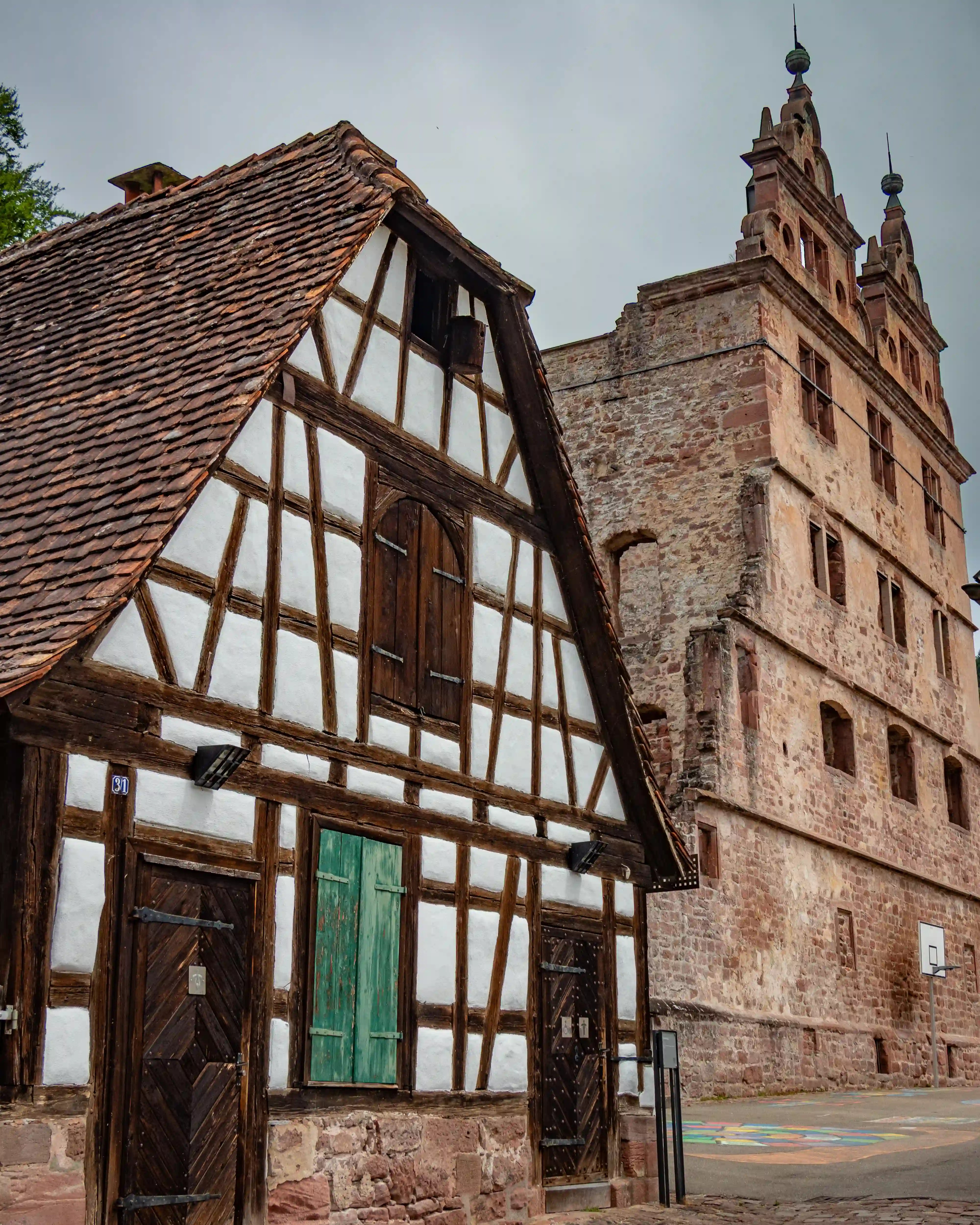 Traditional half-timbered house beside the ruins of the Hunting Lodge at Hirsau Monastery.