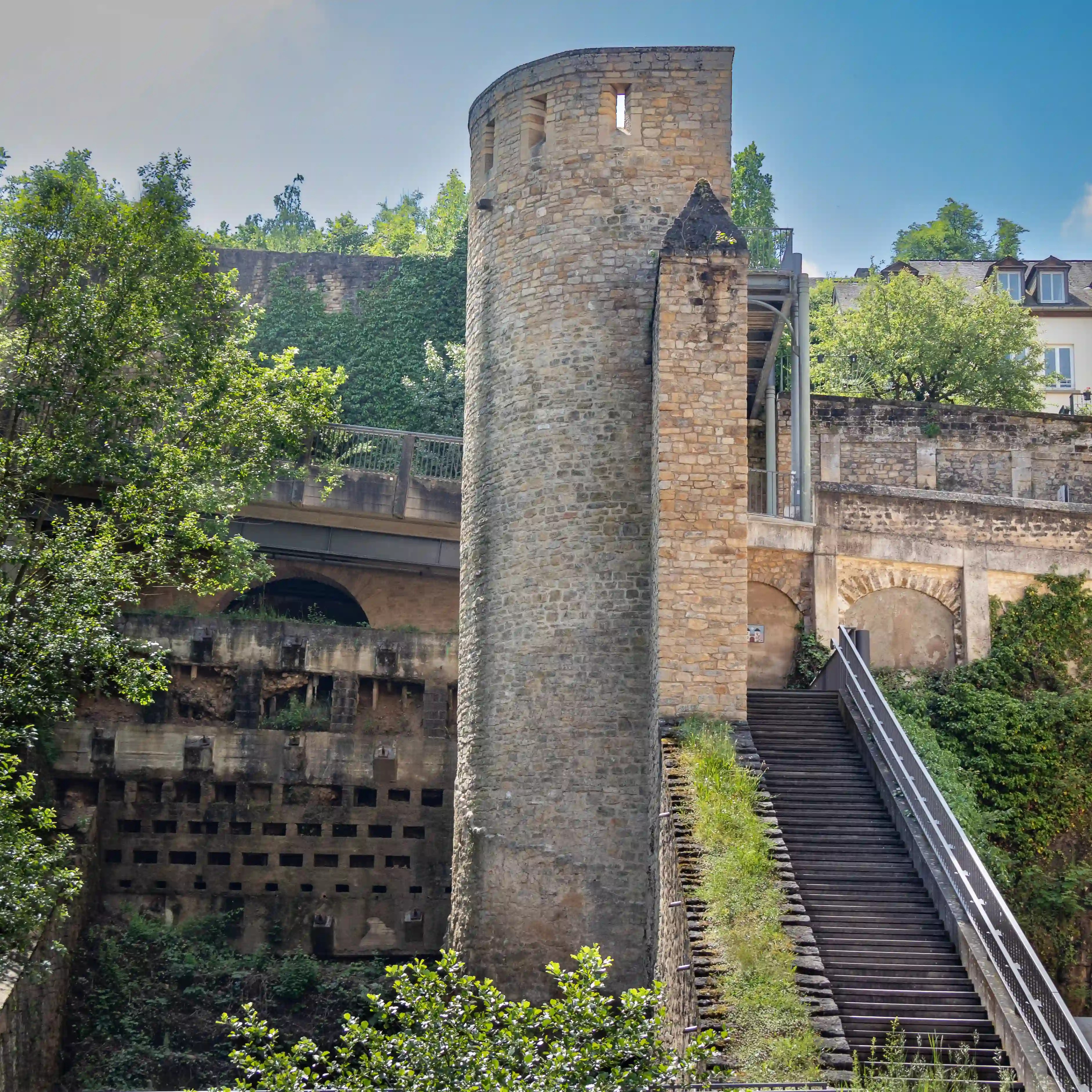Stone watchtower and staircase leading up through the fortifications in Luxembourg City.