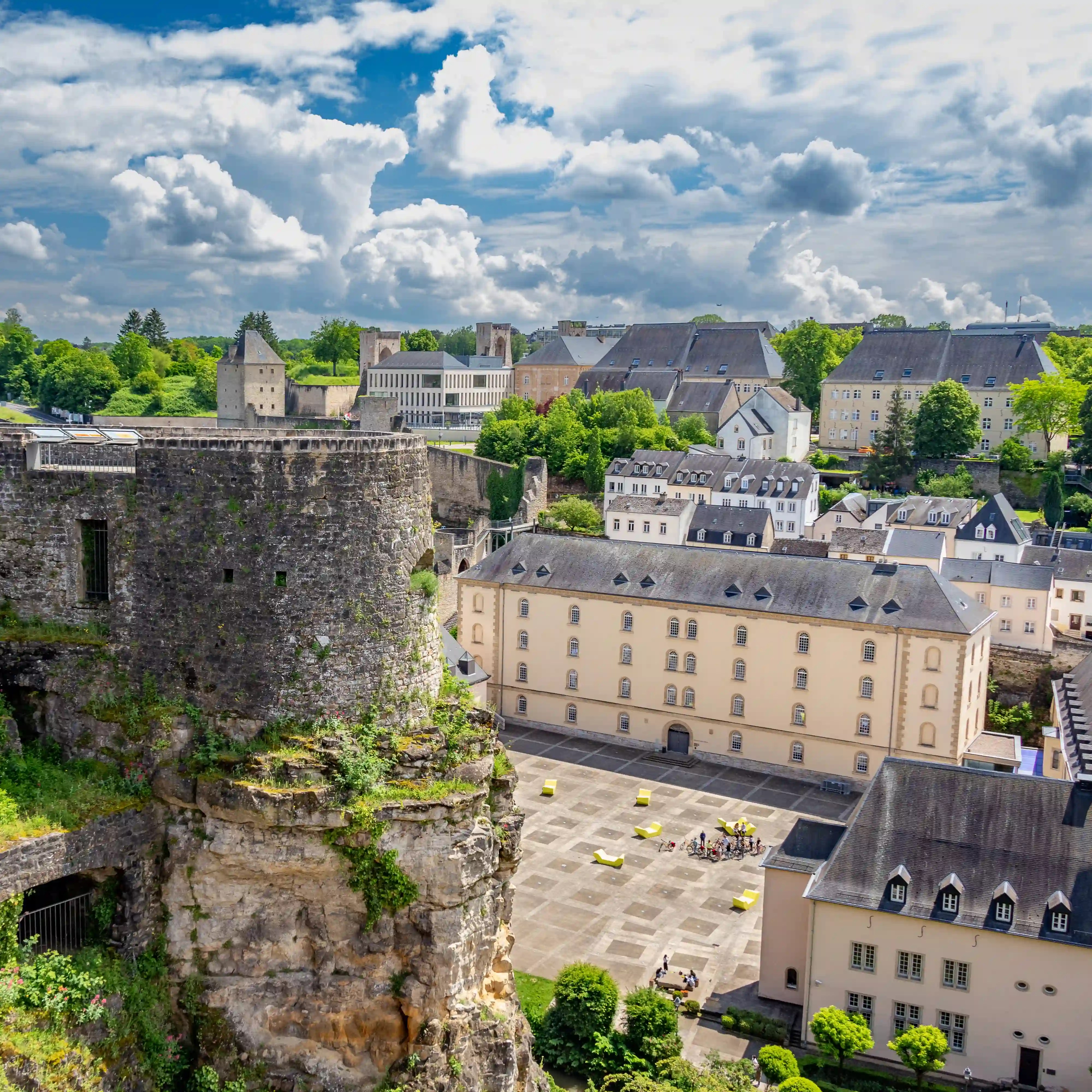 View of the Bock Casemates ruins and surrounding historic buildings in Luxembourg City.