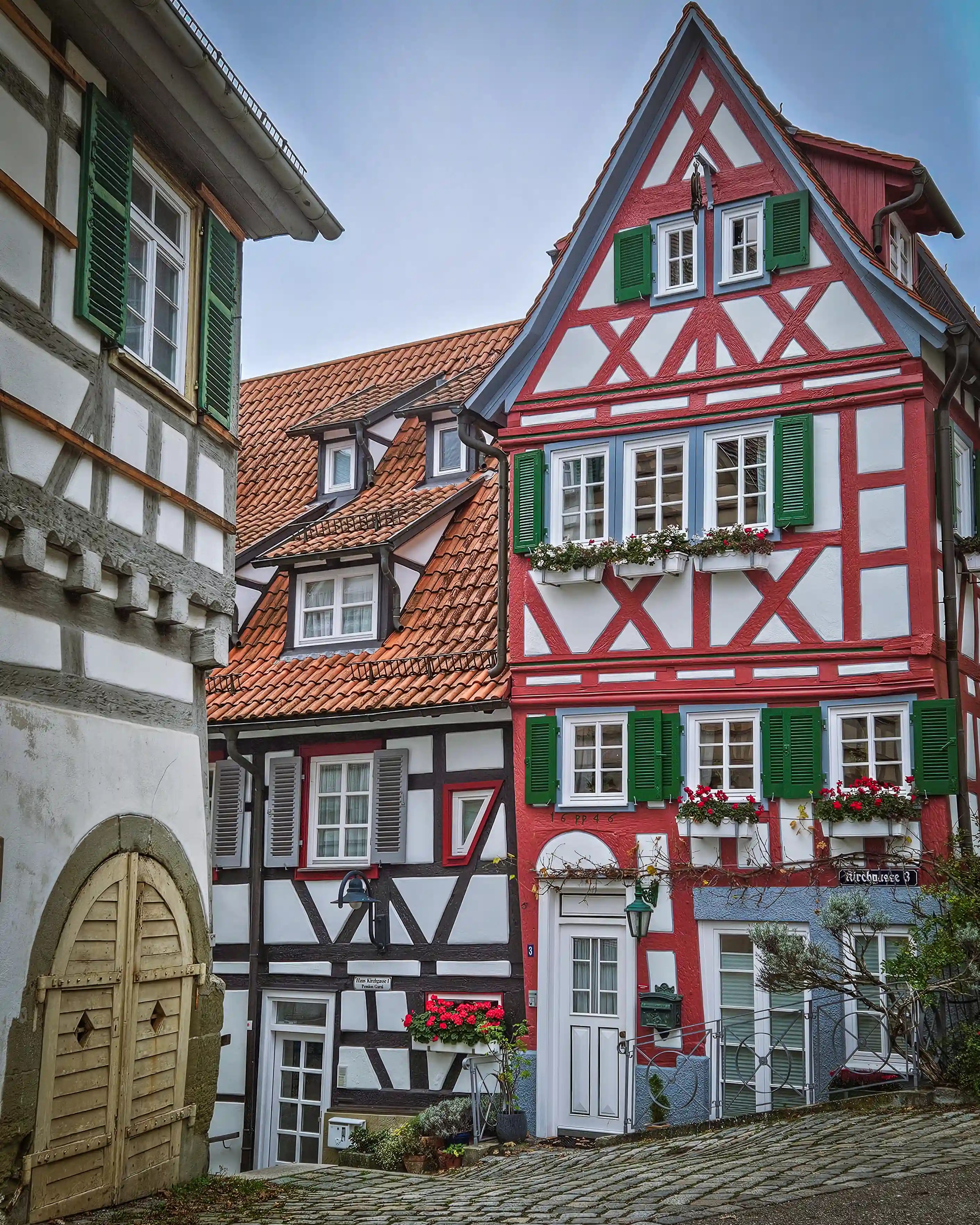 Colorful half-timbered houses with red and green shutters in Herrenberg.