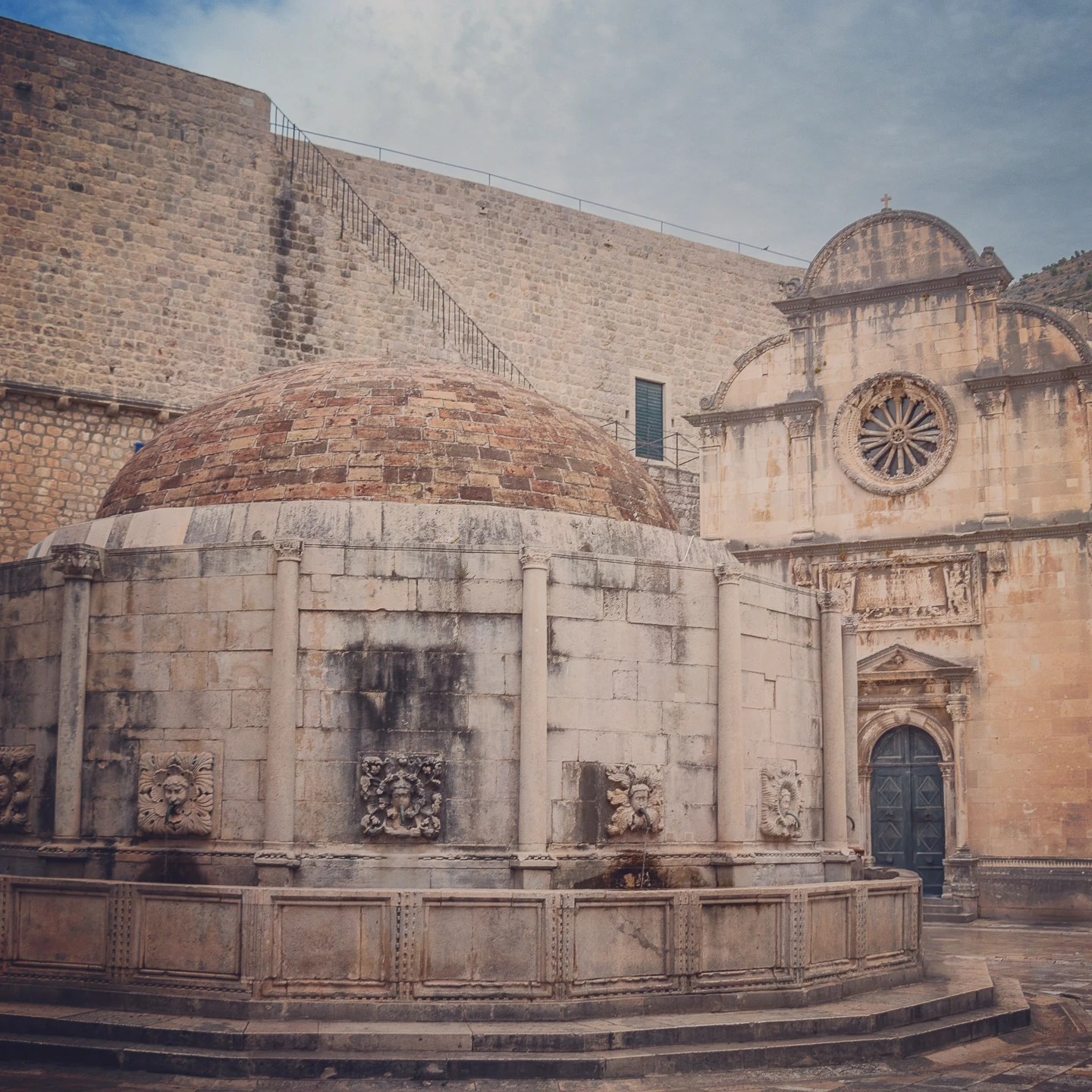 Onofrio’s Fountain and the nearby St. Saviour Church along Dubrovnik’s main street, Stradun.