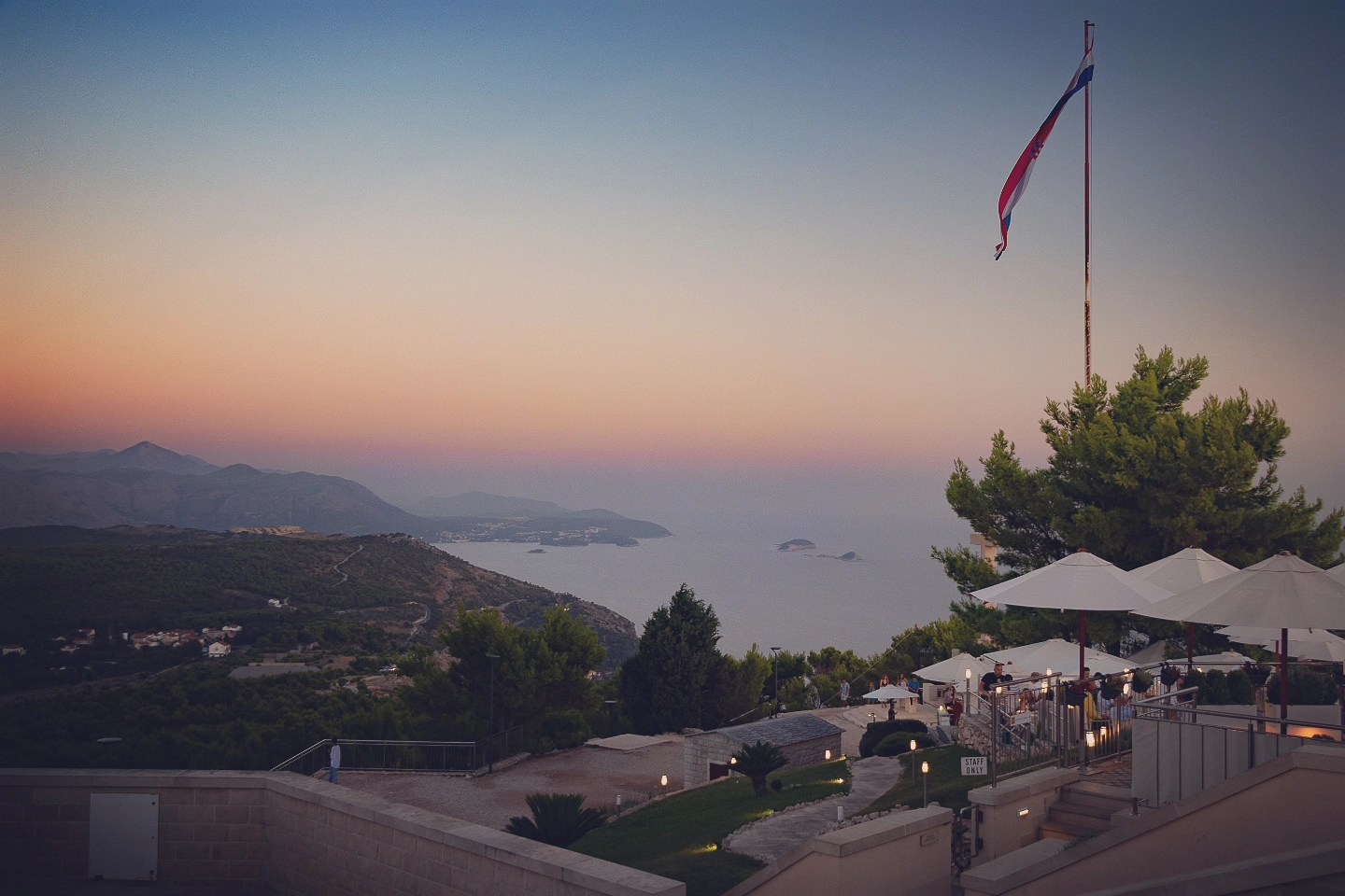 Sunset view from a terrace restaurant on Mount Srđ overlooking Dubrovnik and the Adriatic Sea.