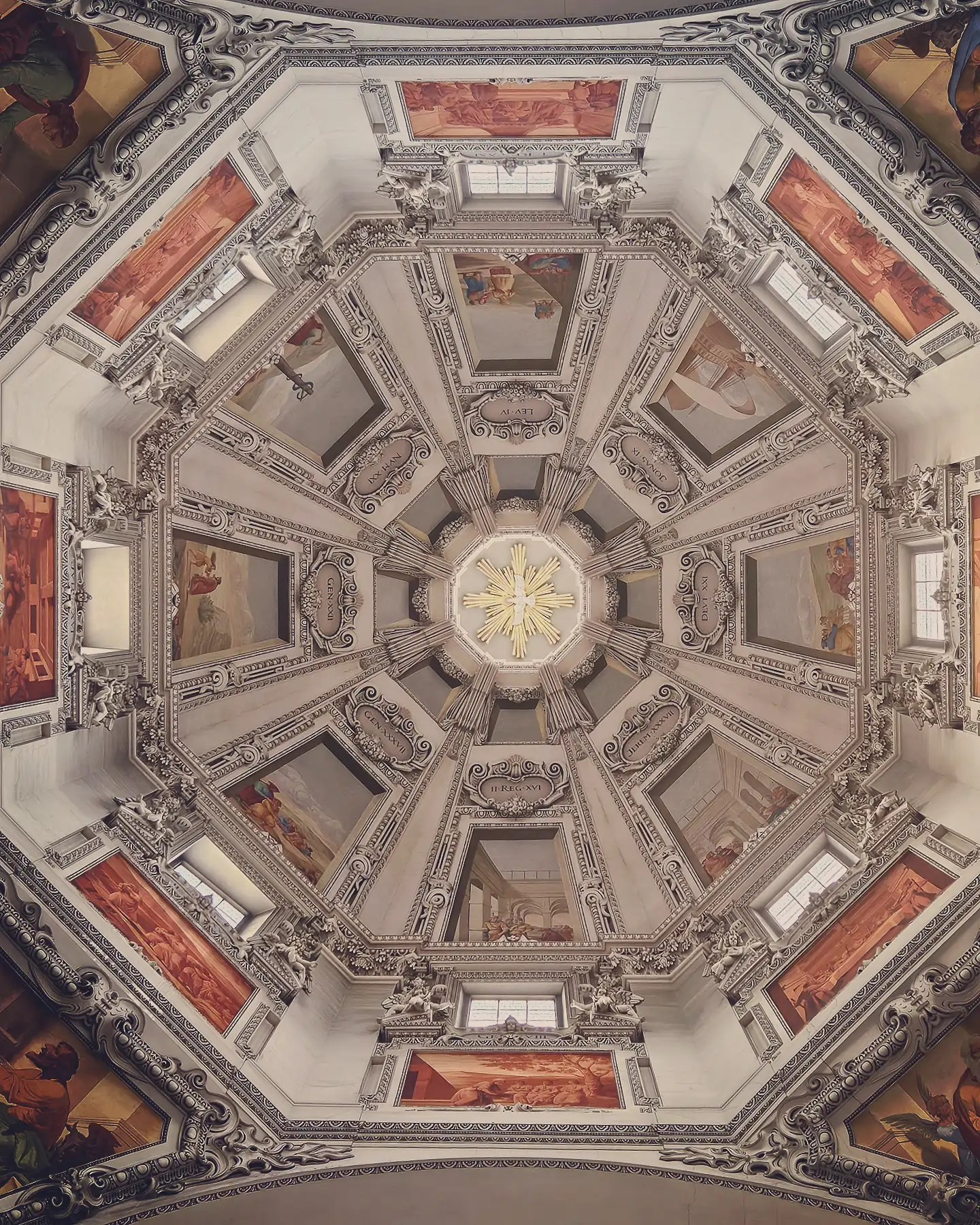 Looking straight up at Salzburg Cathedral’s dome, showing painted frescos arranged around a central image of a white dove.