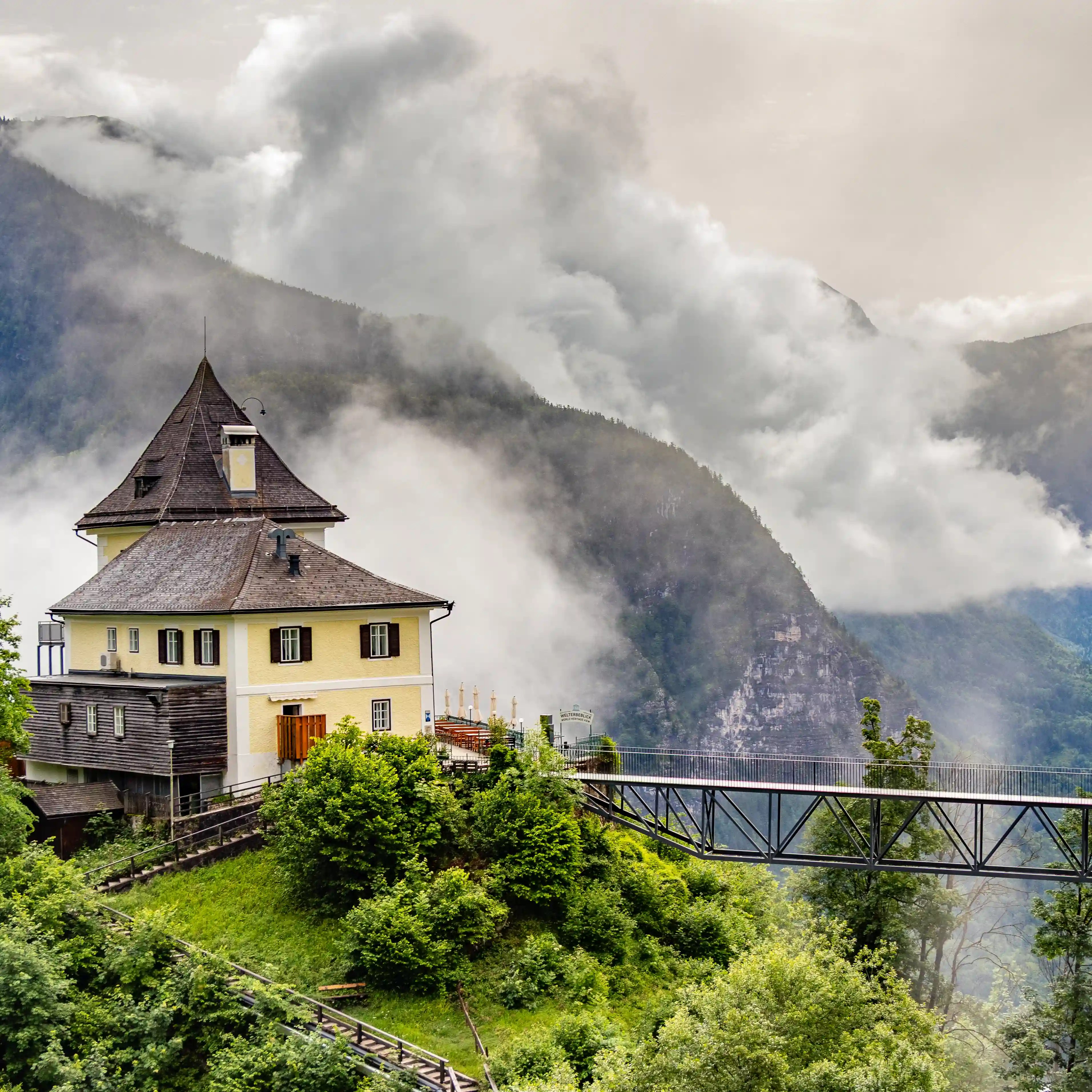 Rudolfsturm restaurant and walkway leading to the Hallstatt Skywalk above the alpine valley.