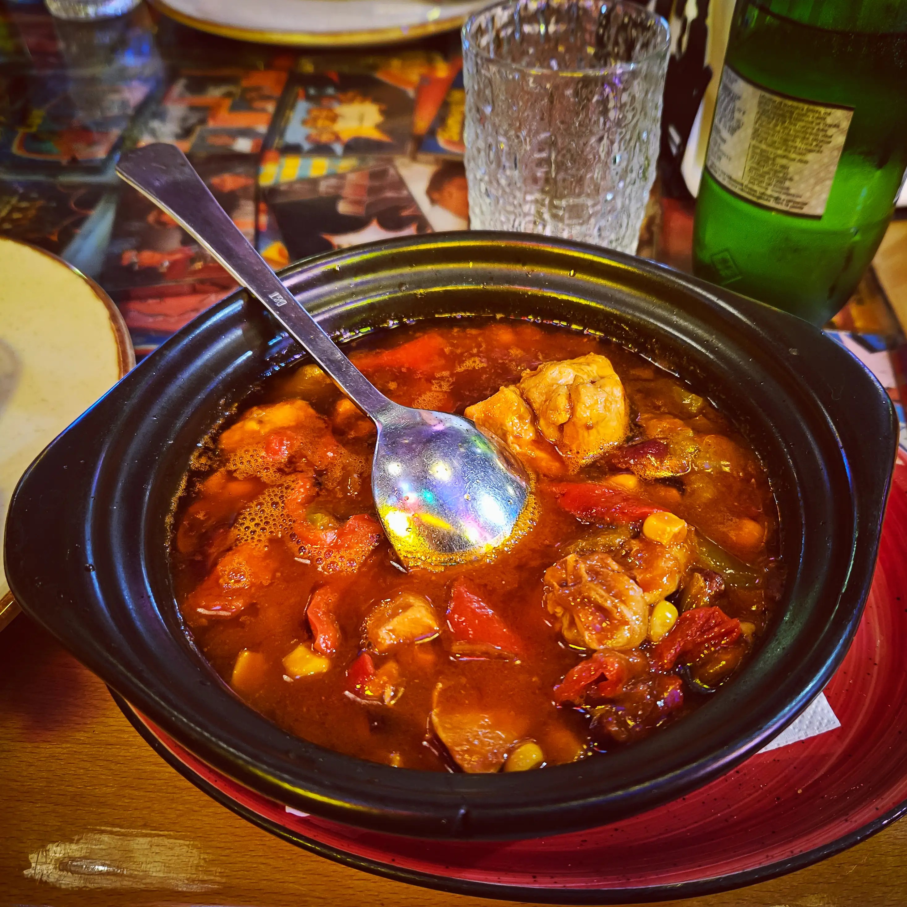 A bowl of hearty stew with vegetables and meat served at Restorant Tymi in Tirana.