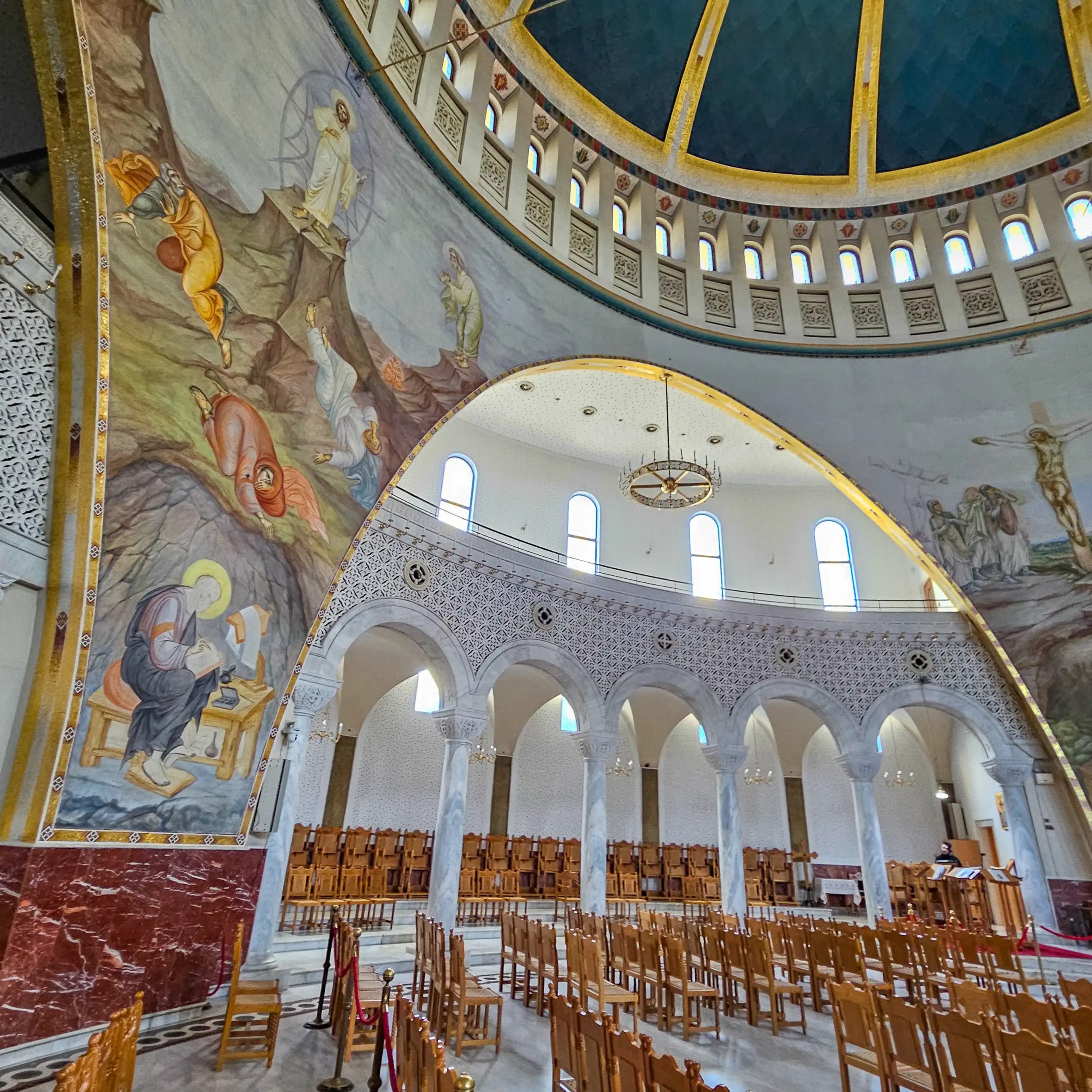 Religious murals and arches inside the Resurrection of Christ Orthodox Cathedral in Tirana.
