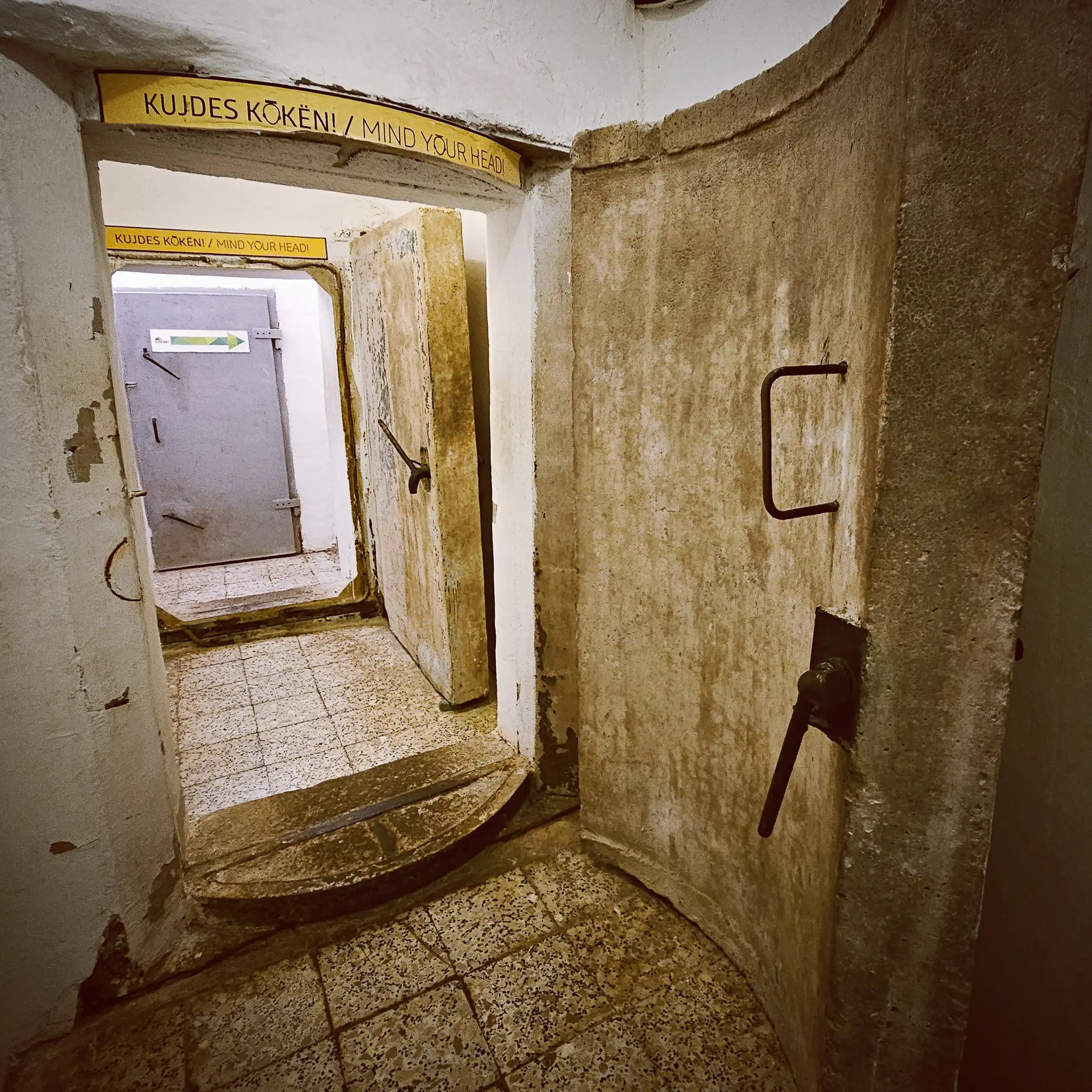 Heavy concrete blast doors and narrow corridors inside the underground bunker at Bunk'Art 1 in Tirana, Albania.