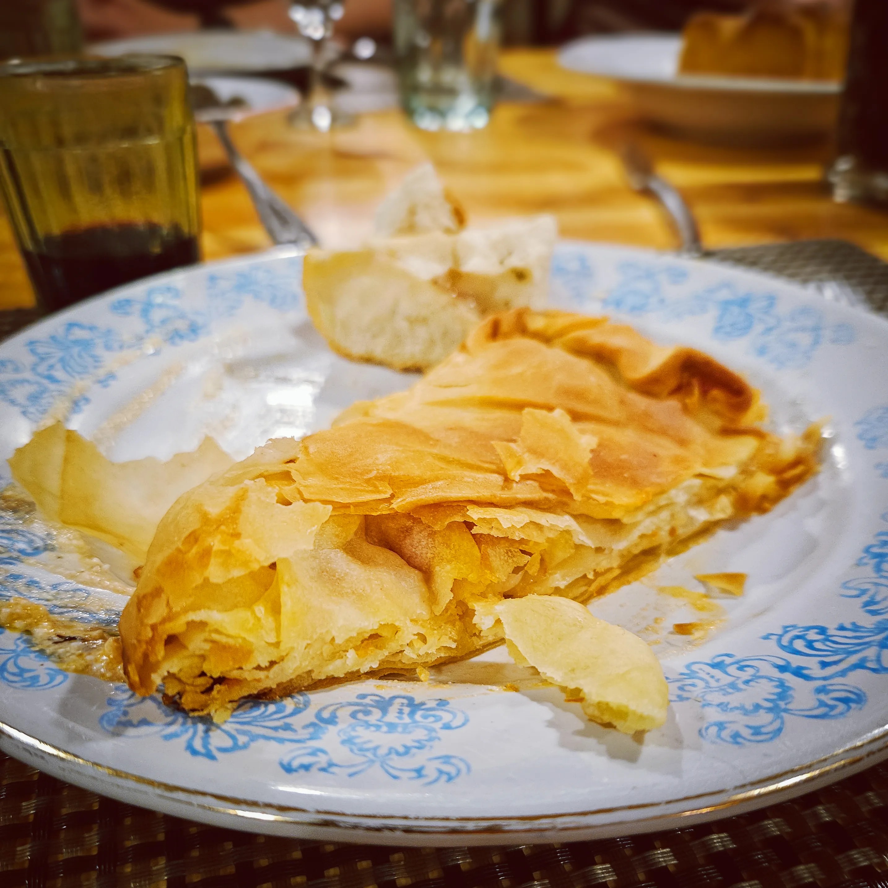 A slice of freshly baked byrek on a plate at a cooking class in Tirana.
