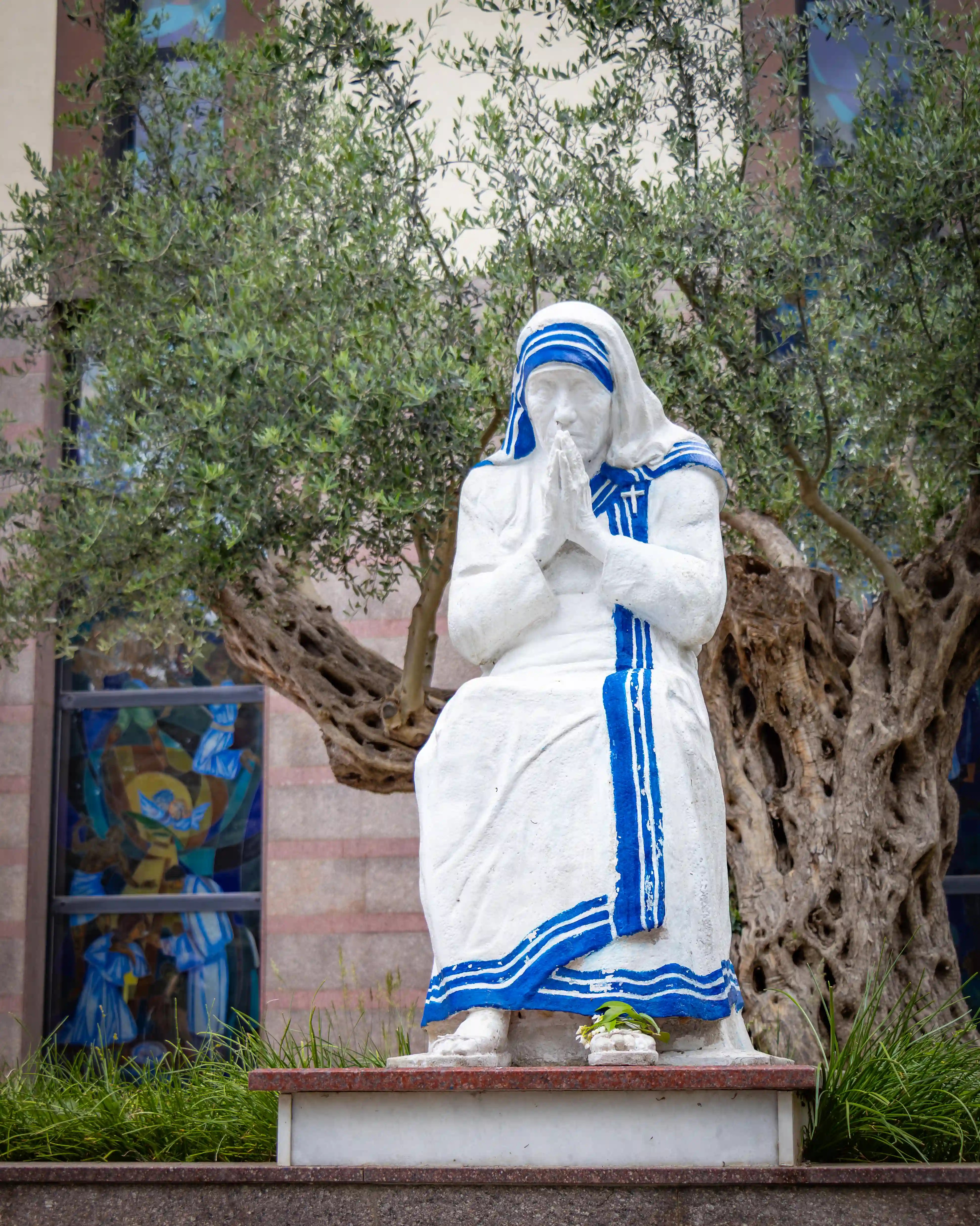 Statue of Mother Teresa in prayer outside St. Paul's Cathedral in Tirana.