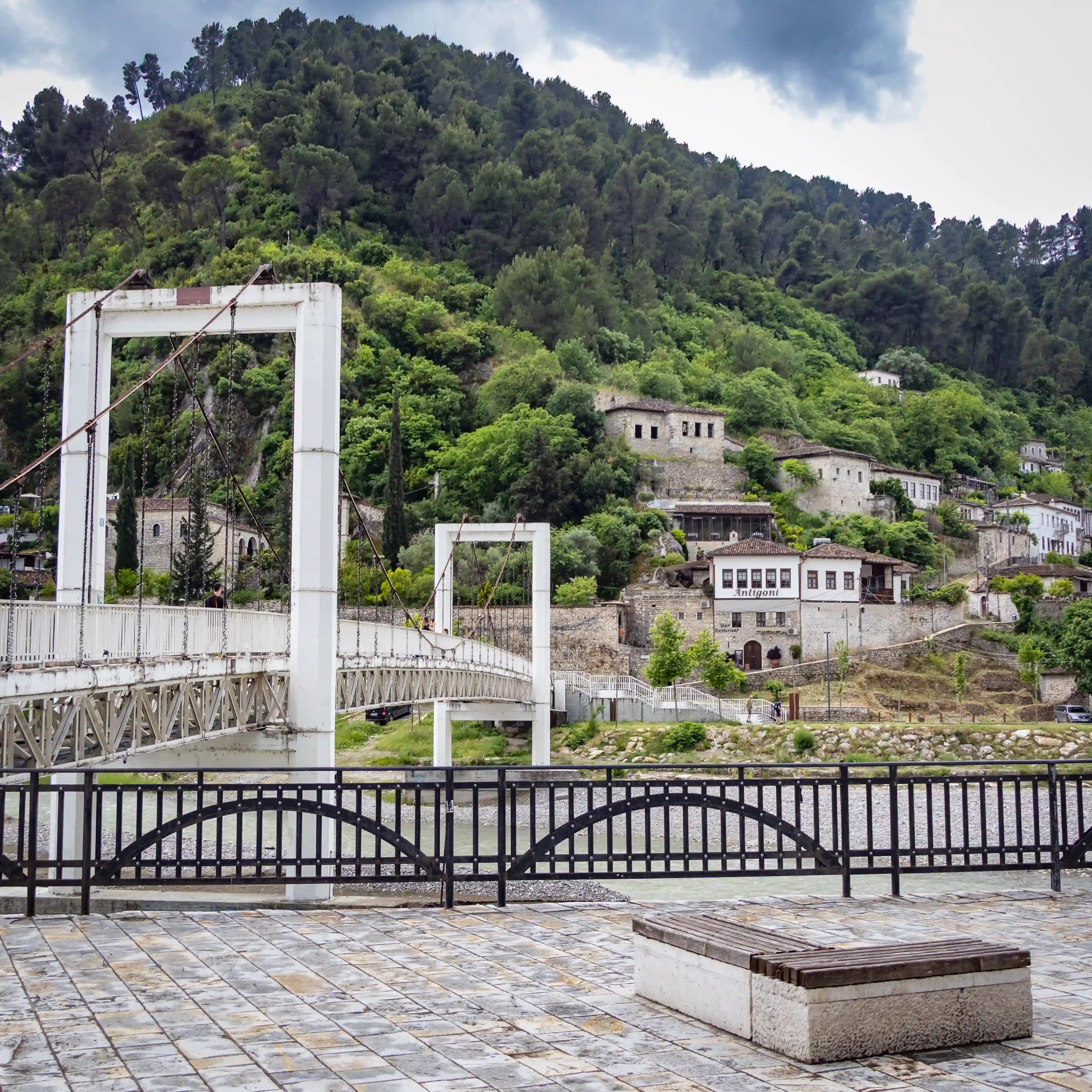 The Suspension Bridge spans the Osum River with the historic Gorica neighborhood rising behind it.